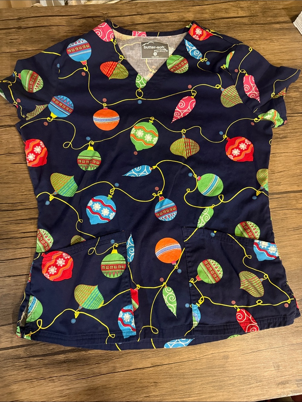 Butter-Soft Navy Short Sleeve Scrub Top with Festive Ornament Print